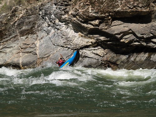 River raft coming out of water in rapids