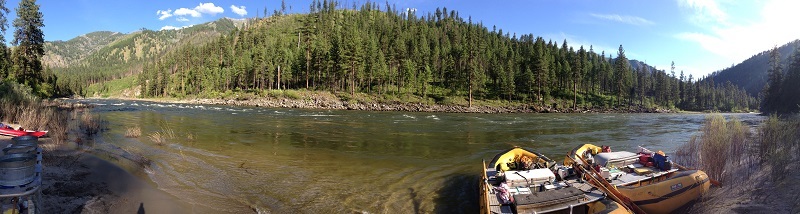 Boats ready at river's edge for water rafting adventure